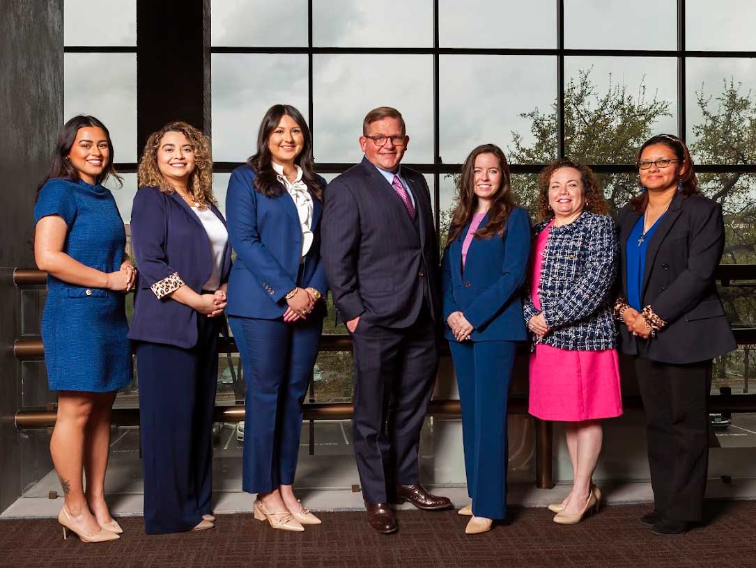 Family law attorneys in San Antonio team photo in the lobby of office.